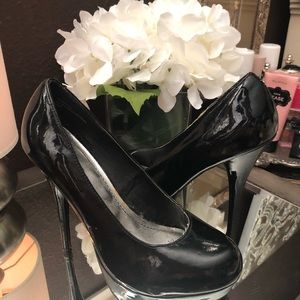 Black platform pumps